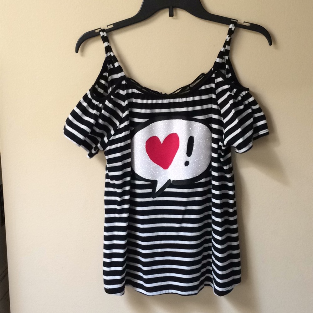 Justice shirt shoulders showing tie in back